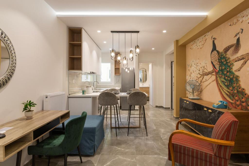 a kitchen and dining room with a table and chairs at The Caravan Apartments in Thessaloniki