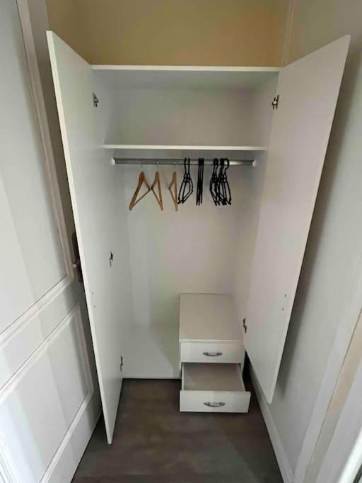 a walk in closet with a box and shoes at Appartement atypique et original in Nice