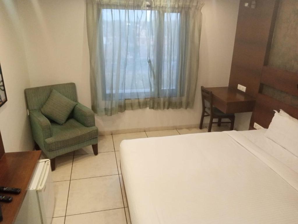 Postel nebo postele na pokoji v ubytování Hotel Kanan