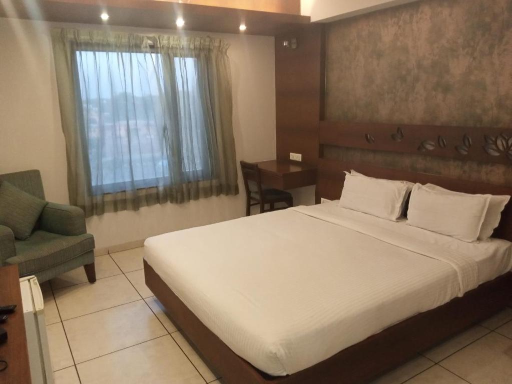Postel nebo postele na pokoji v ubytování Hotel Kanan
