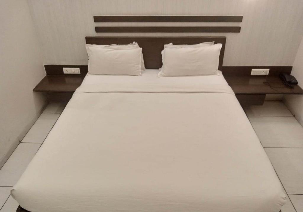 Postel nebo postele na pokoji v ubytování Hotel Kanan