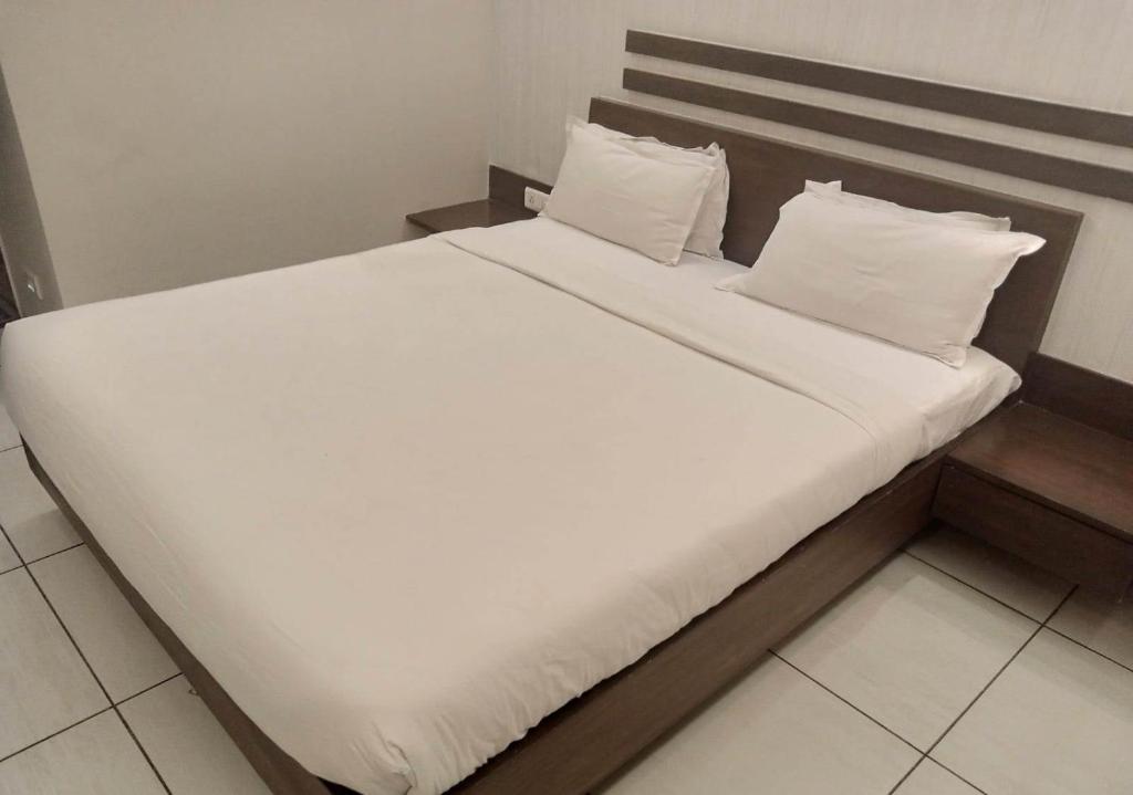 Postel nebo postele na pokoji v ubytování Hotel Kanan