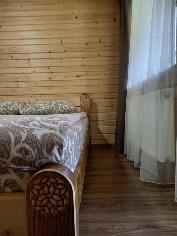 Postel nebo postele na pokoji v ubytování Voyage Tatariv