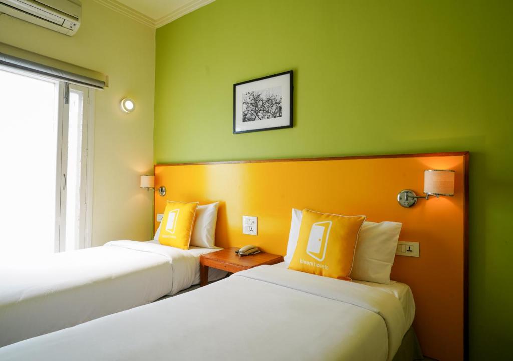 Postel nebo postele na pokoji v ubytování Bloom Boutique l Signature Towers