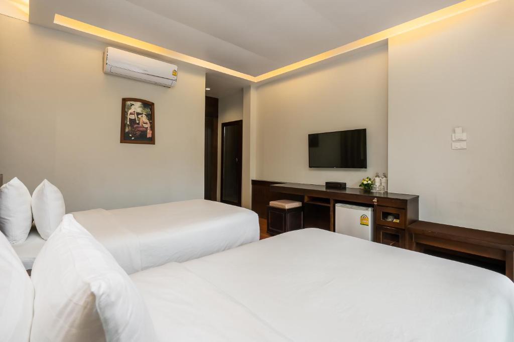 Postel nebo postele na pokoji v ubytování Koh Chang Paradise Resort & Spa