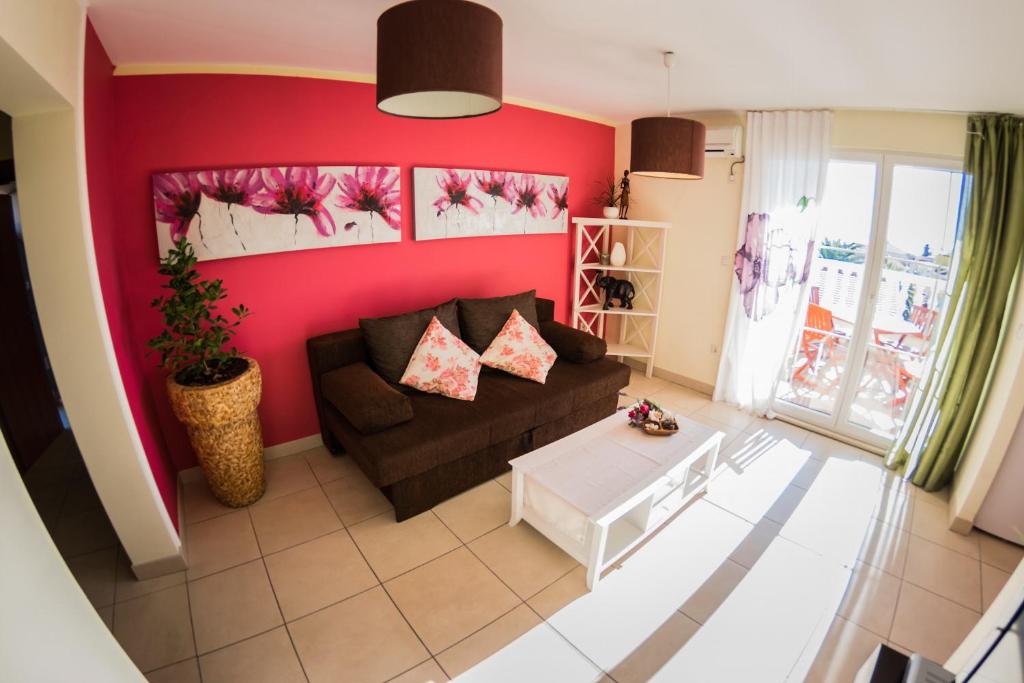 En eller flere senge i et værelse på Captain's House