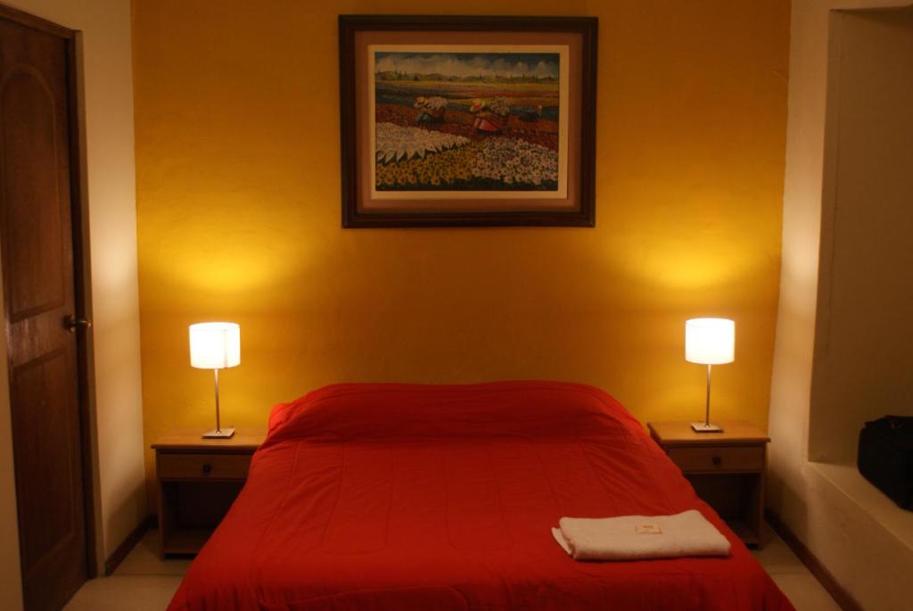 Postel nebo postele na pokoji v ubytování Flying Dog Hostel Arequipa