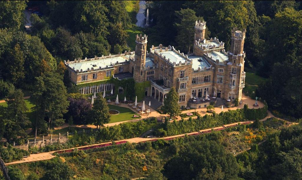 an aerial view of a castle with trees at Hotel Schloss Eckberg in Dresden