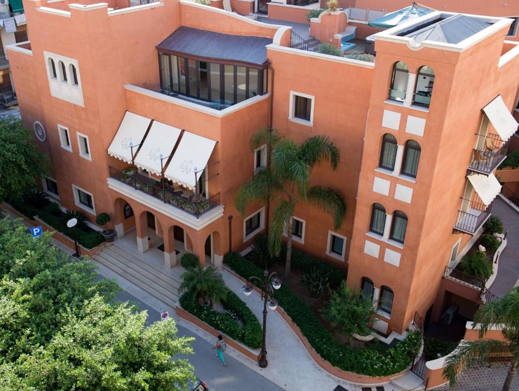 an overhead view of a large orange building at Artemis Hotel in Cefalù