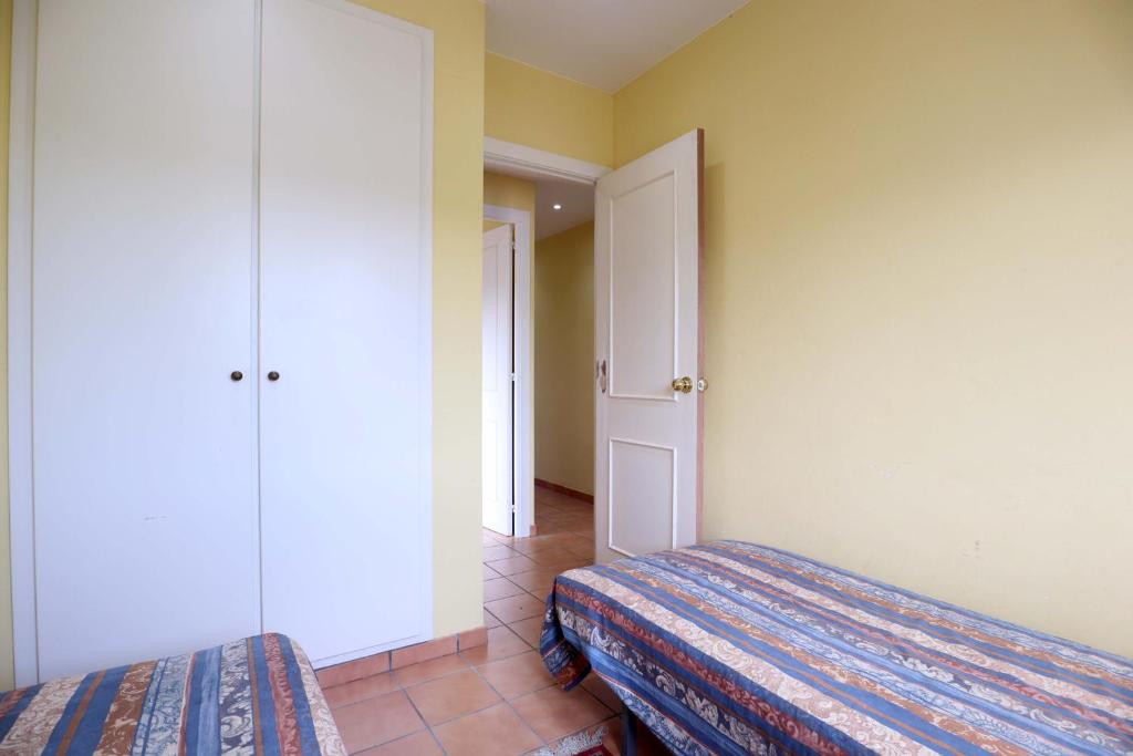 Posteľ alebo postele v izbe v ubytovaní Amplio Apartamento Bahia II