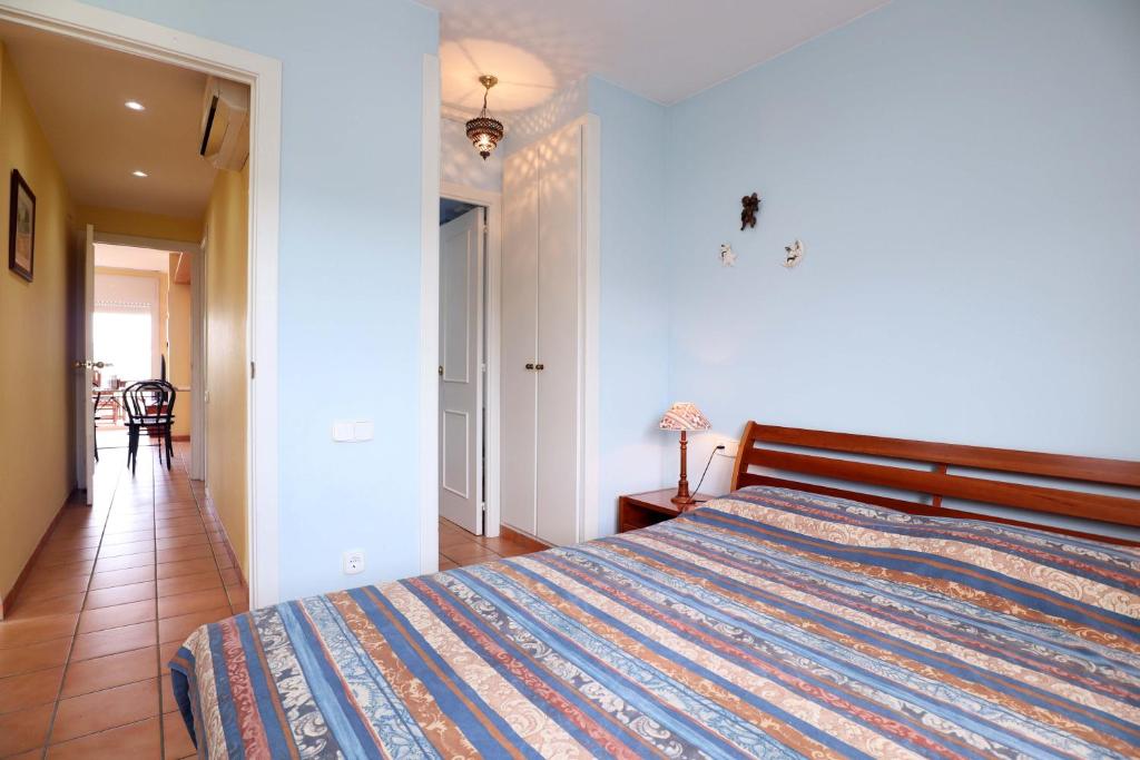 Posteľ alebo postele v izbe v ubytovaní Amplio Apartamento Bahia II