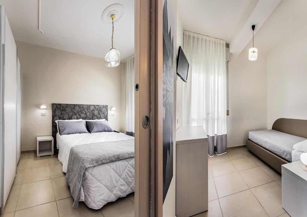 Postel nebo postele na pokoji v ubytování Hotel Caesar