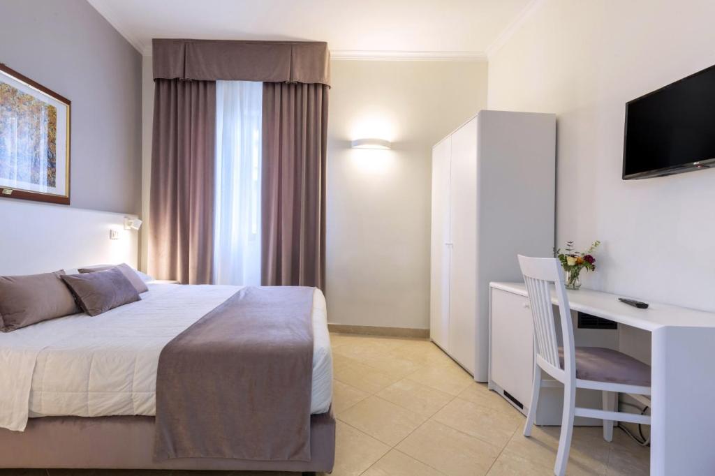 Łóżko lub łóżka w pokoju w obiekcie Hotel Centrale Spa & Relax
