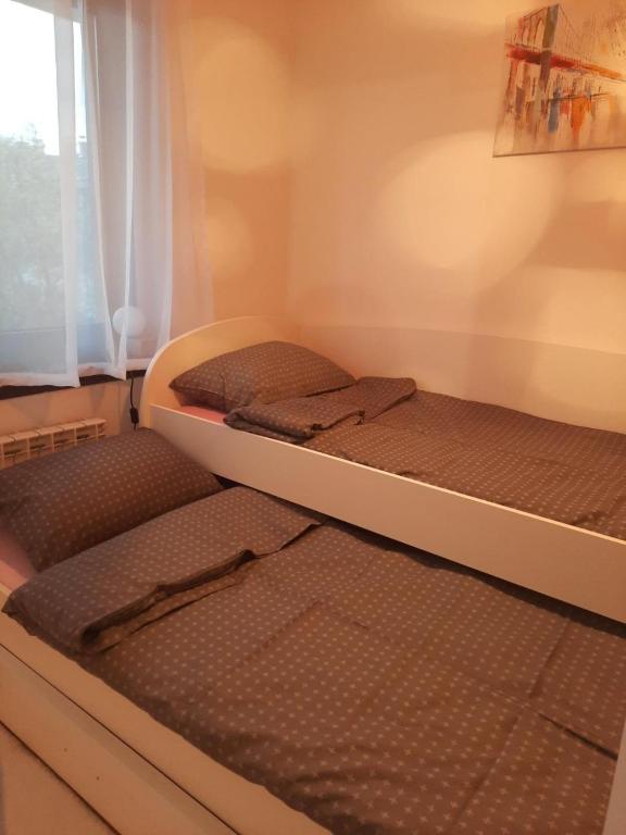 Postel nebo postele na pokoji v ubytování Džoni