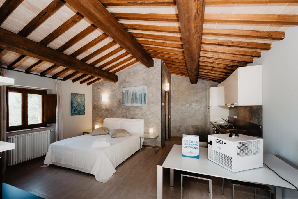 Postel nebo postele na pokoji v ubytování Borghetto Poggio Bianco