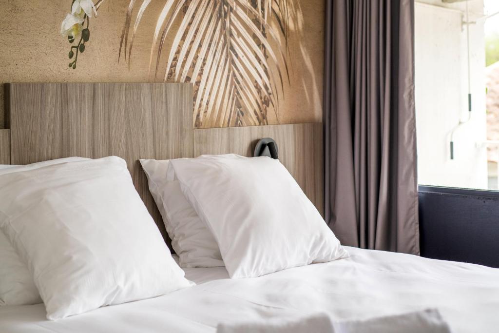 Postel nebo postele na pokoji v ubytování O'Cub Hotel