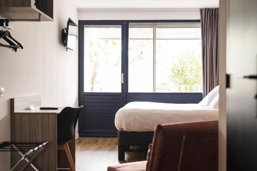 Postel nebo postele na pokoji v ubytování O'Cub Hotel