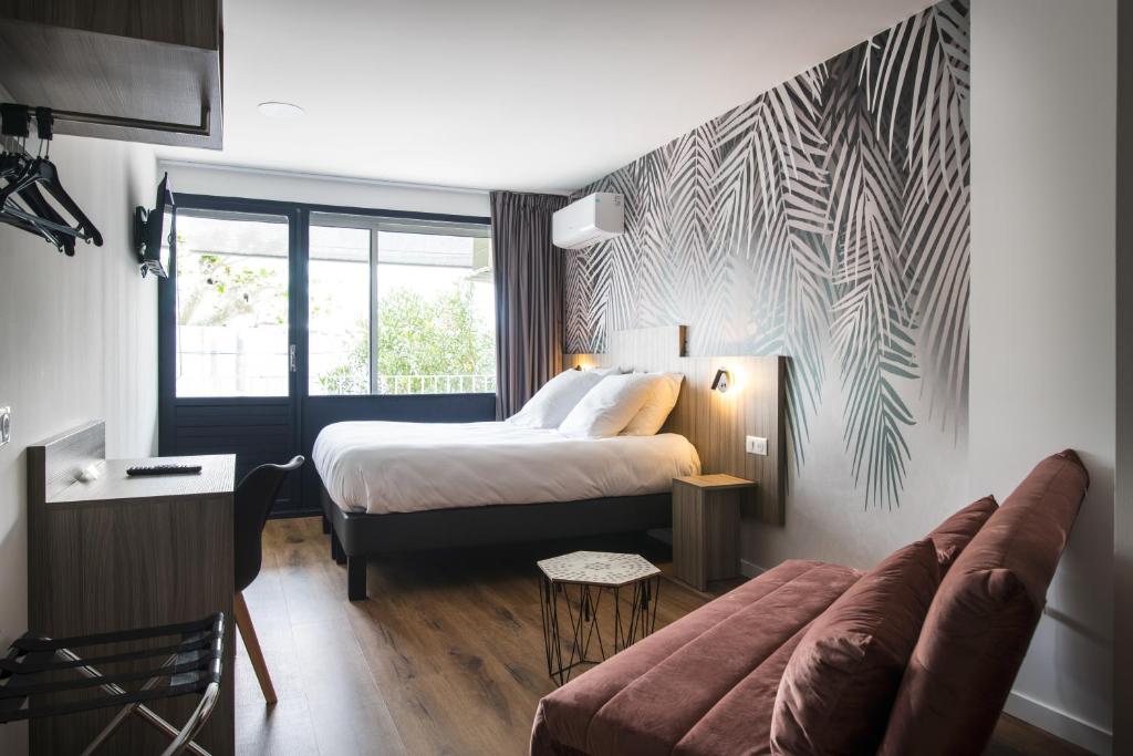Postel nebo postele na pokoji v ubytování O'Cub Hotel