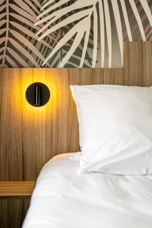 Postel nebo postele na pokoji v ubytování O'Cub Hotel