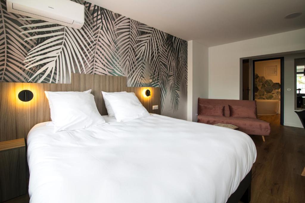Postel nebo postele na pokoji v ubytování O'Cub Hotel