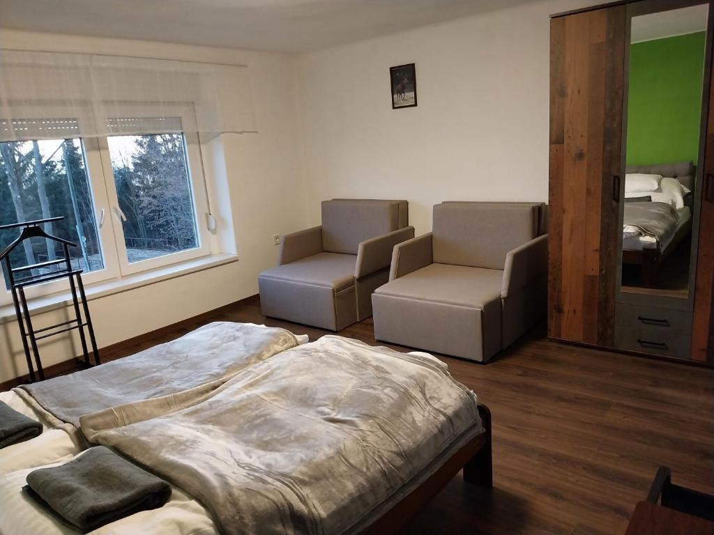 Postel nebo postele na pokoji v ubytování Mátrai5Vendégház