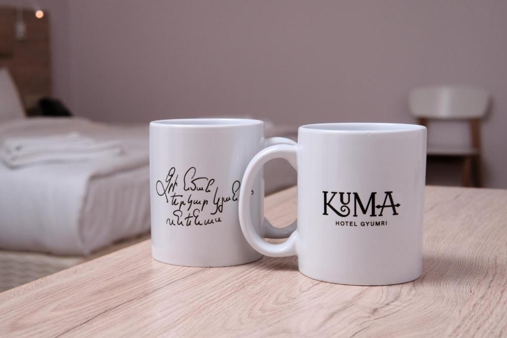 Postel nebo postele na pokoji v ubytování KUMA Hotel Gyumri