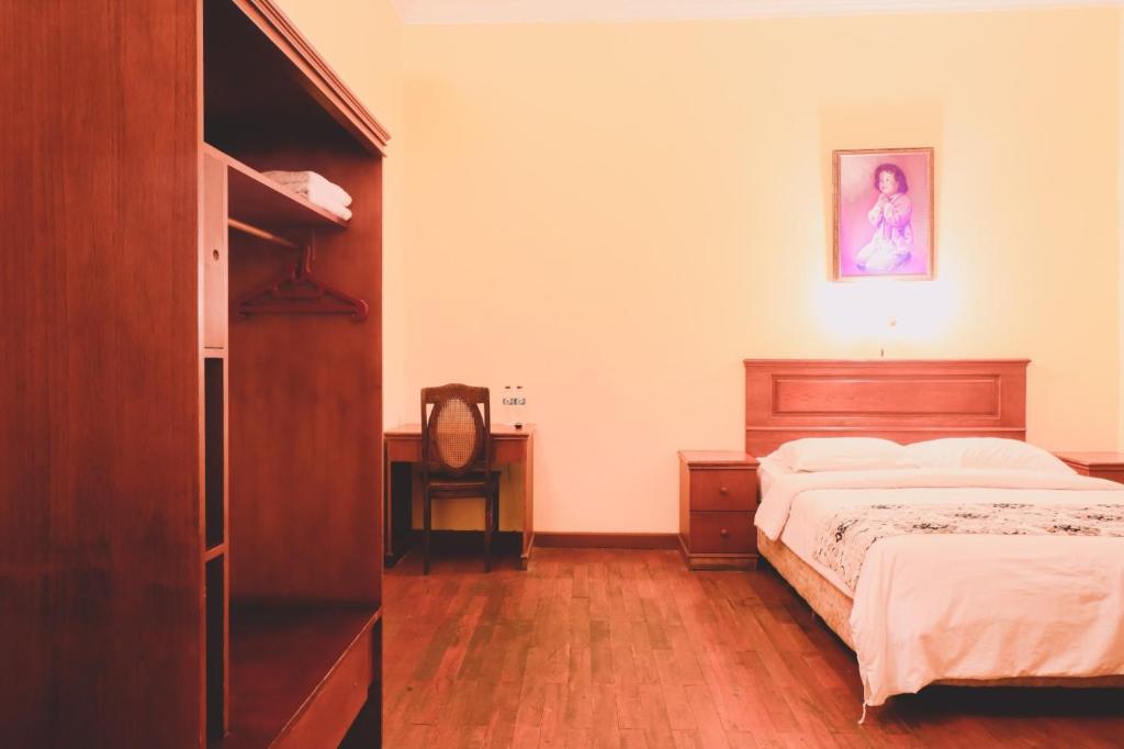 Postel nebo postele na pokoji v ubytování PIA Hotel Medan