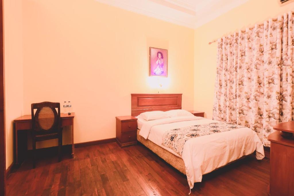 Postel nebo postele na pokoji v ubytování PIA Hotel Medan