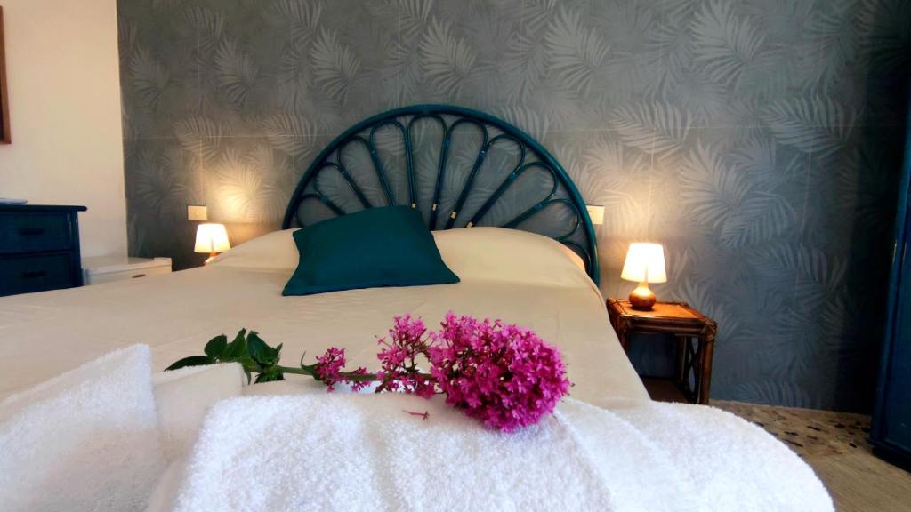 Postel nebo postele na pokoji v ubytování Hotel Golfo Azzurro