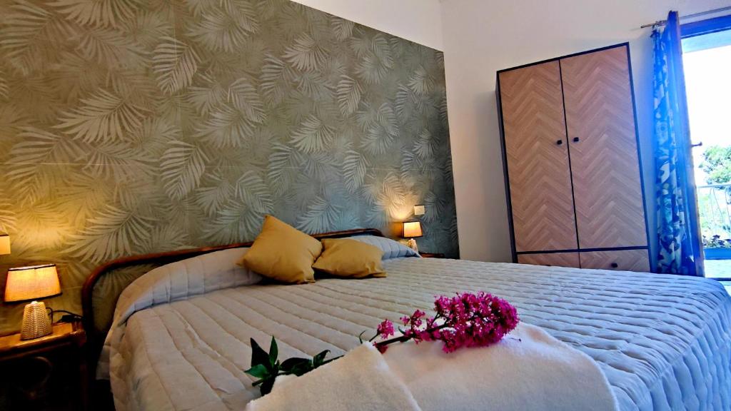 Postel nebo postele na pokoji v ubytování Hotel Golfo Azzurro