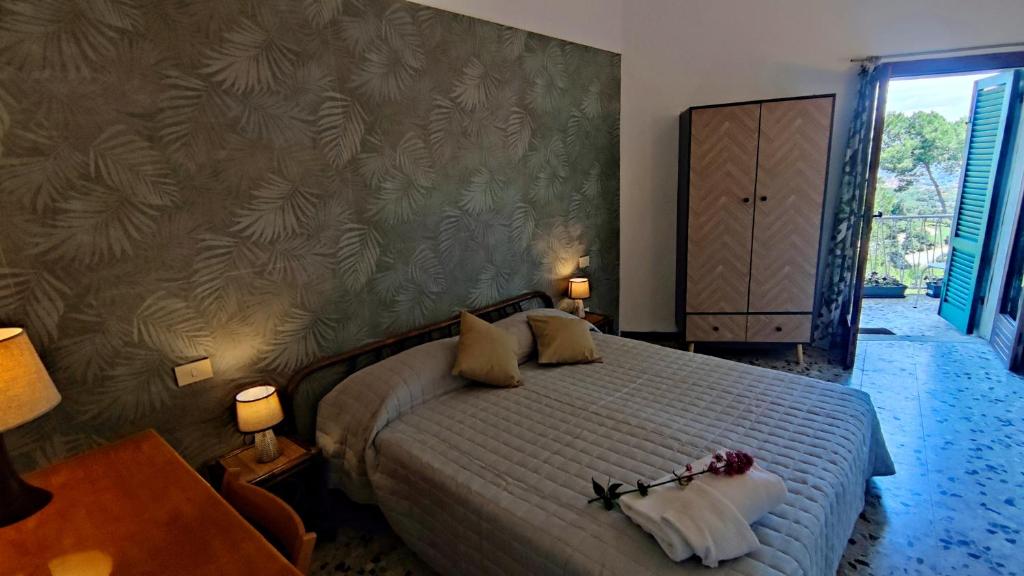 Postel nebo postele na pokoji v ubytování Hotel Golfo Azzurro