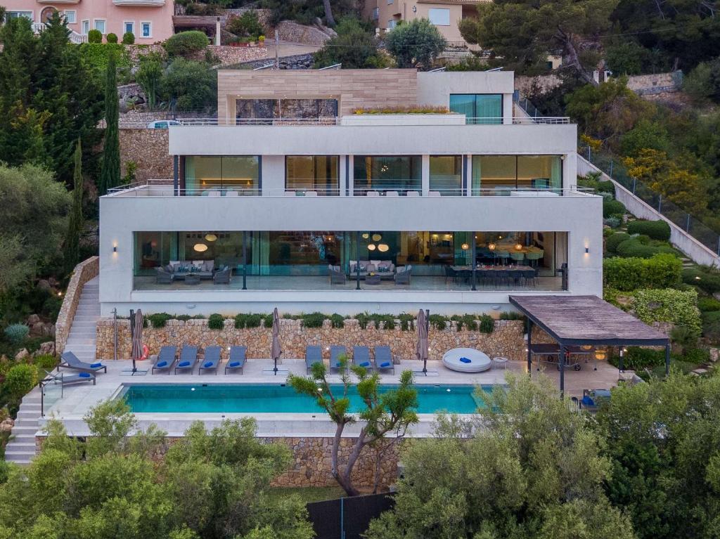 an aerial view of a house with a swimming pool at Villa Marvelo in El Port