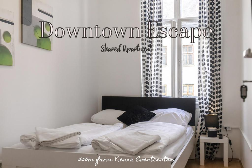 a bedroom with a bed with white sheets and a window at Viennese 3BR shared Apt. Near Wiener Stadthalle & Central in Vienna