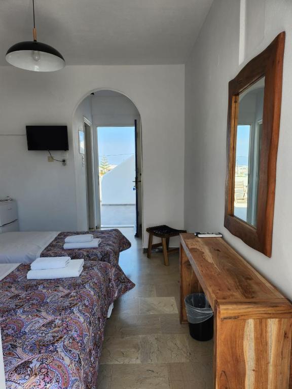 Postel nebo postele na pokoji v ubytování Hotel Kastelakia Mykonos