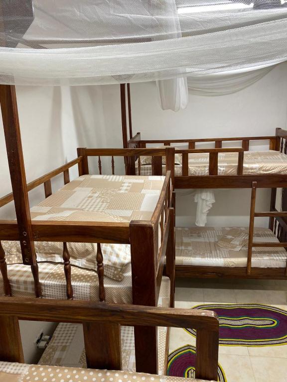 Postel nebo postele na pokoji v ubytování Sanaa Hostel