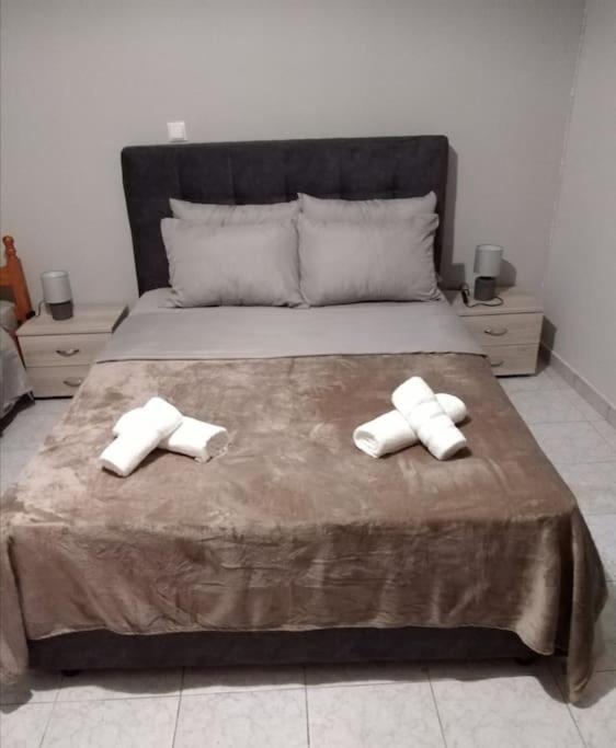 Postel nebo postele na pokoji v ubytování Vion Place Pilos