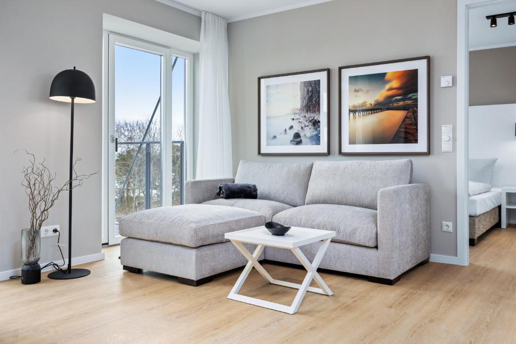 a living room with a couch and a table at Strandresidenzen Binz-Prora Strandresidenzen Binz-Prora D5 5 in Binz
