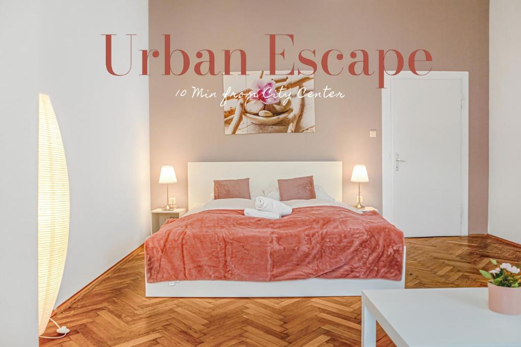 a bedroom with a bed with a orange comforter at commodious 3BR Apt. Ideal for Families and Friends in Vienna