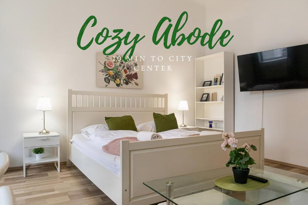 a bedroom with a bed and a tv at Super helles Apartment - perfect for Longstays in Vienna