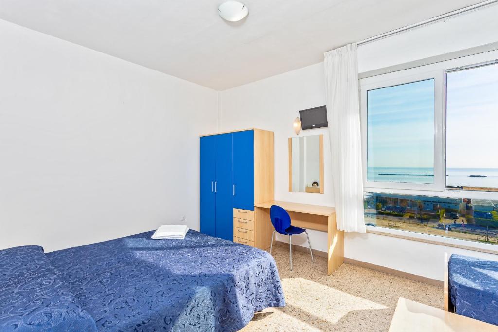 Postel nebo postele na pokoji v ubytování Hotel Eritrea