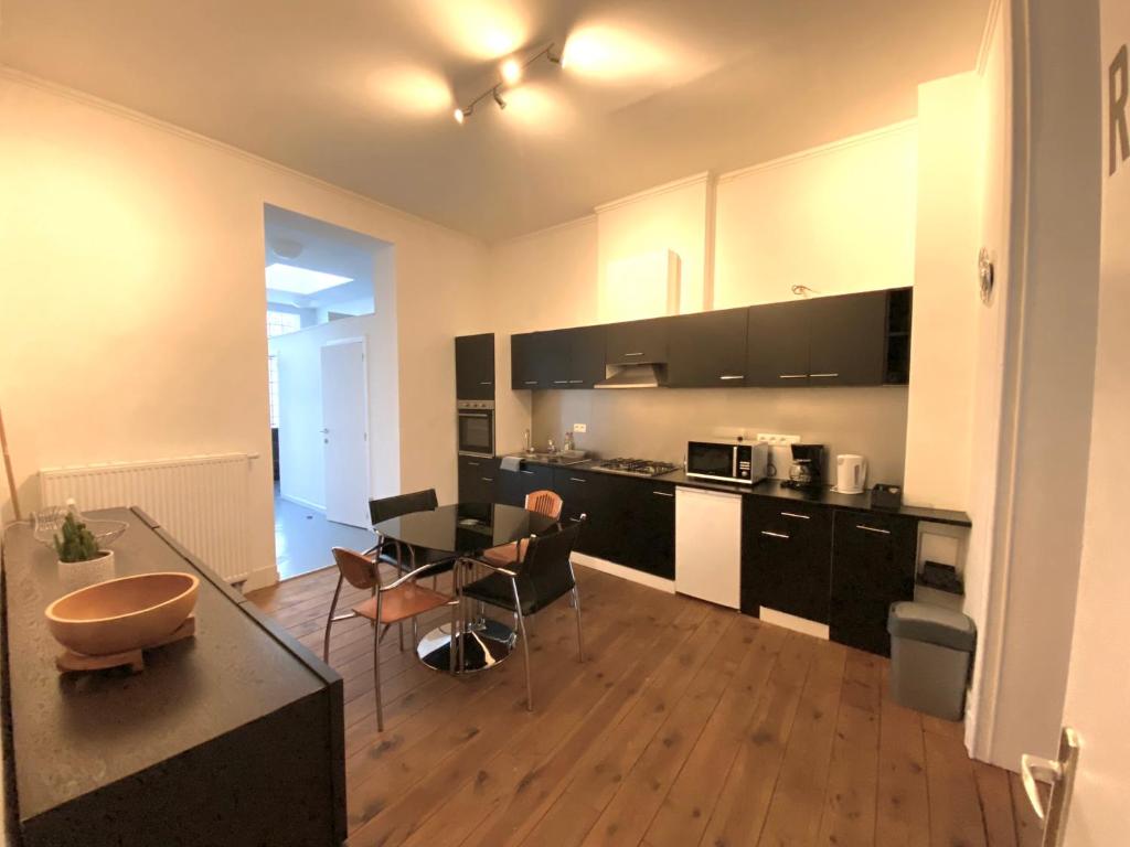 Kuchyň nebo kuchyňský kout v ubytování Au logement mosan