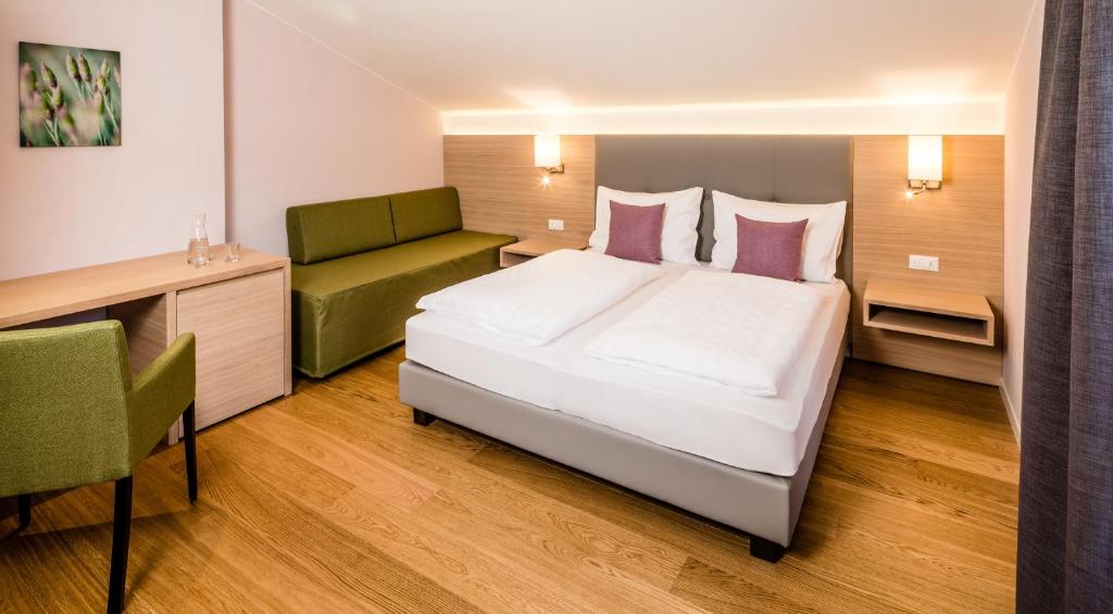 Postel nebo postele na pokoji v ubytování Hotel Jardis