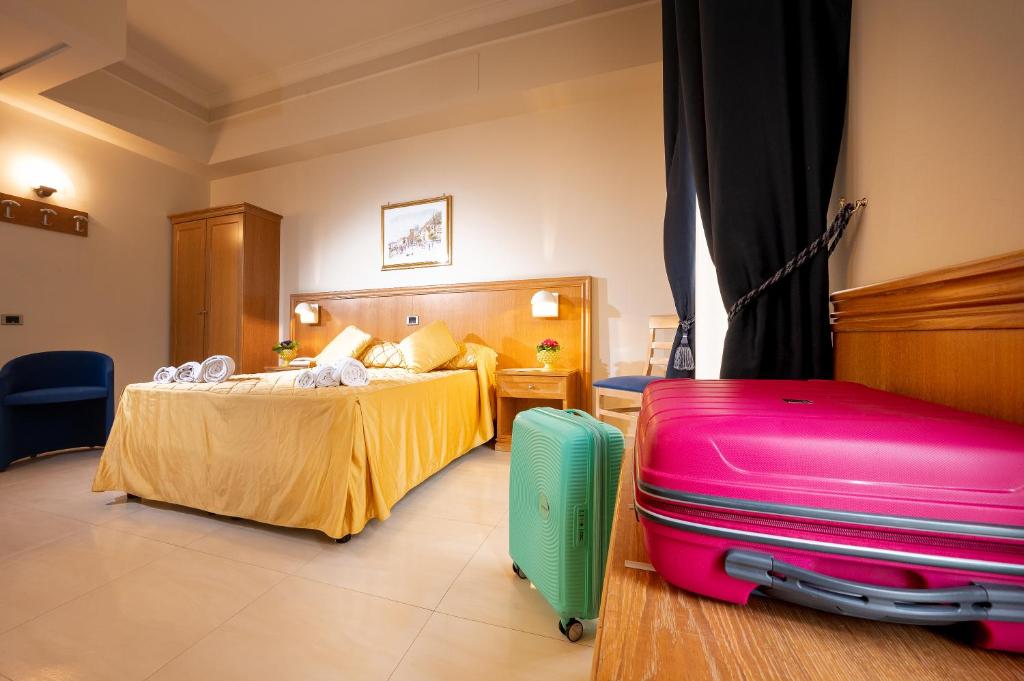 Łóżko lub łóżka w pokoju w obiekcie Hotel Sabbie d'Oro
