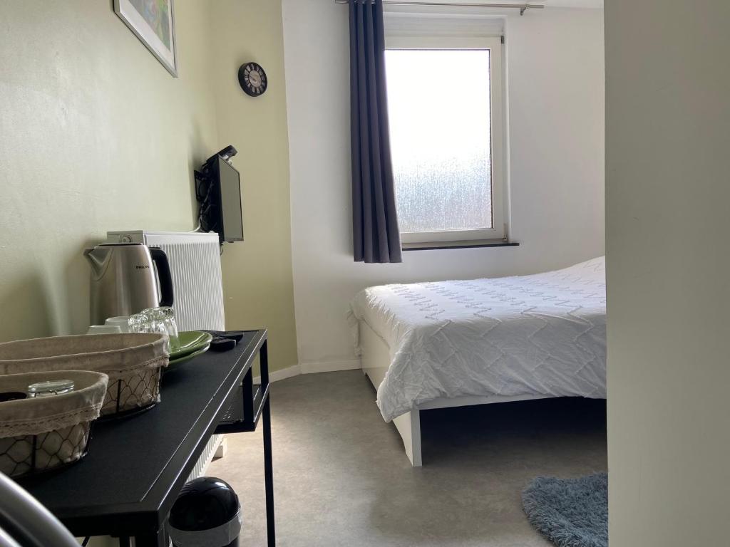 Postel nebo postele na pokoji v ubytování Au logement mosan