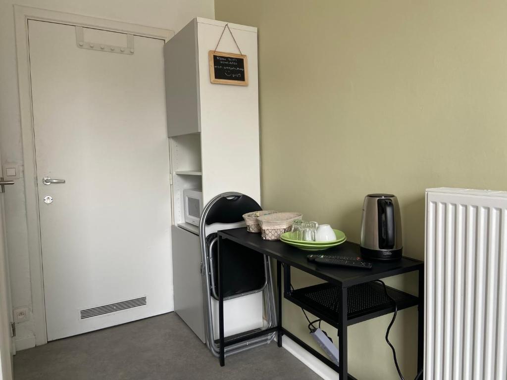 Kuchyň nebo kuchyňský kout v ubytování Au logement mosan