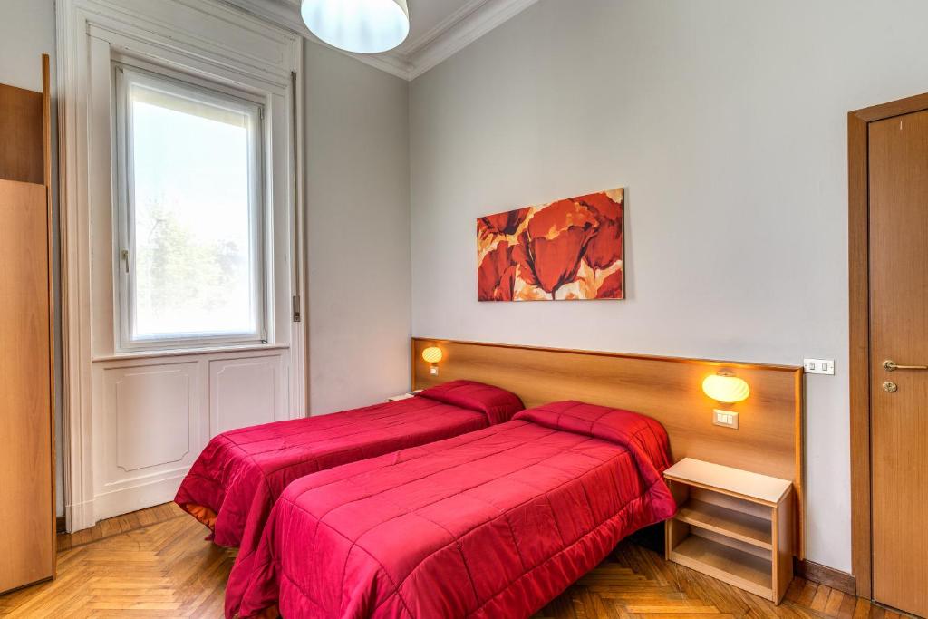 Letto o letti in una camera di Hotel Apollo