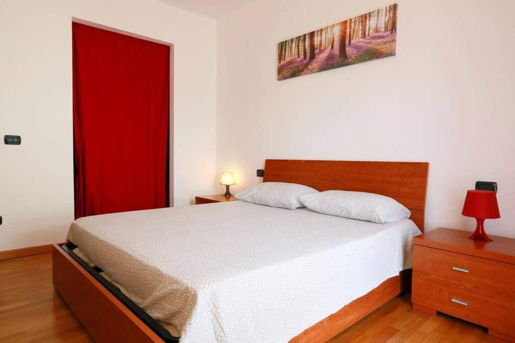 Postel nebo postele na pokoji v ubytování Quercegrossa 10