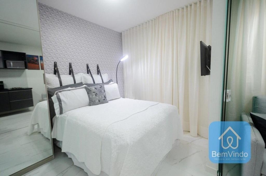 A bed or beds in a room at Studio aconchegante a 150m da Praia de Piatã