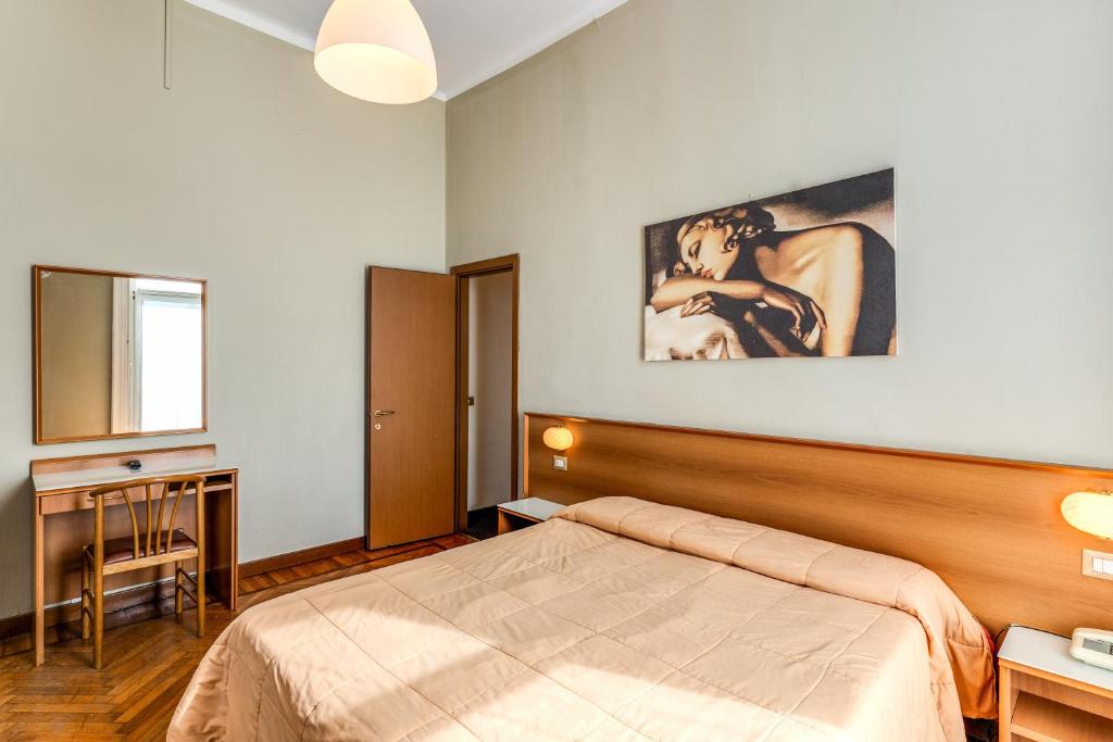 Letto o letti in una camera di Hotel Apollo