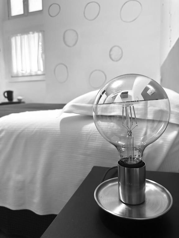 Postel nebo postele na pokoji v ubytování Boutique Hotel Novecento